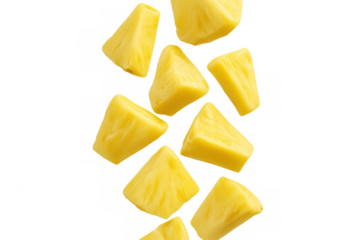 Ripe pineapple chunks dropping with splash effect, showcasing fresh tropical fruit against clean transparent backdrop