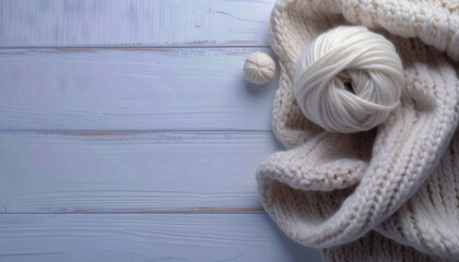 Knitting wool yarn balls in on a wooden table with copy space. Cozy knitting scene with warm texture, ideal for craft, handmade, or winter-themed designs.
