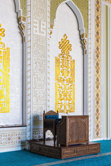 Ornate wooden minbar and golden calligraphy details in Hazrati Imam mosque, Tashkent, Uzbekistan,...