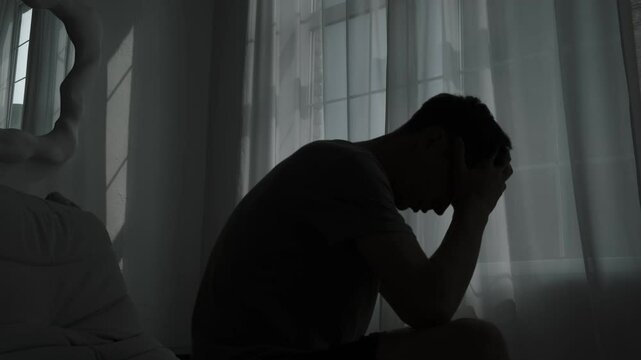 Alone in silence, a man confronts inner demons, facing mental health issues and suicidal thoughts