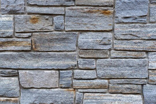 Gray Stone Brick Wall Texture with a stacked layout &ndash; Close-Up Background