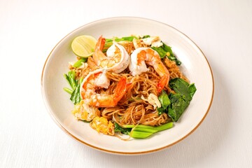 Stir-fried  Thin Rice Noodles with dark Soy Sauce and  shrimp in ceramic plate, 