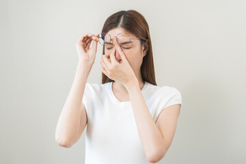 Eye problem concept, fatigue asian young woman tired eyes irritated rubbing, massage nose, relief...