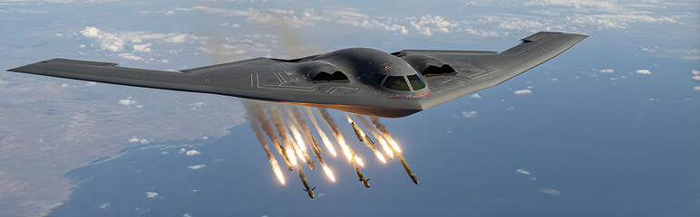 Stealth bomber releasing six SDBs in precise fan-out pattern with laser designation dot blinking, target building showing stress fractures amidst chaos and destruction.