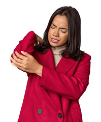 Young filipino woman massaging elbow, suffering after a bad movement.