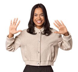 Young filipino woman showing number ten with hands.
