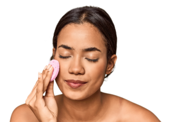 Filipino woman with facial sponge, skincare ritual