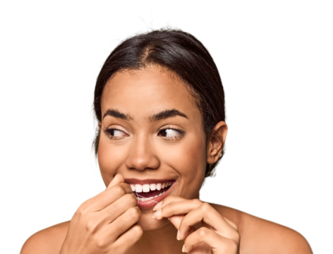 Young Filipino using dental floss, oral care focus