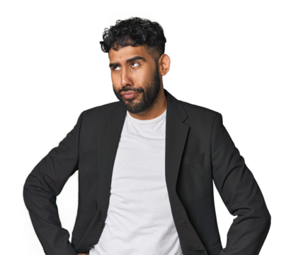 Hispanic businessman in suit in studio confused, feels doubtful and unsure.