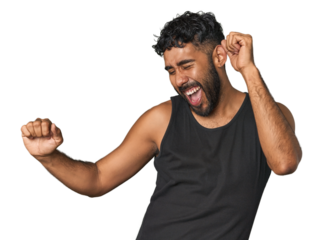 Young Hispanic man isolated dancing and having fun.