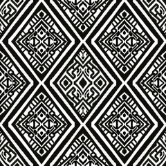 Fototapeta premium This high-contrast black and white Ikat pattern features intricate Thai-inspired motifs in a diamond layout. Perfect for textile design, fabric prints, or cultural digital art projects.
