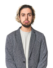 Young businessman in casual blazer sad, serious face, feeling miserable and displeased.