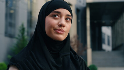 Portrait worried hesitate unsure pensive Muslim positive Islamic woman wearing hijab businesswoman business female girl in city outdoor thinking problem solution decide pondering think difficulty idea
