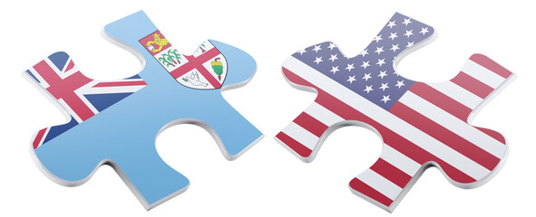 Two puzzle pieces, one displaying the flag of Fiji and the other adorned with the flag of the United States, symbolize potential collaboration and the intricate connections.