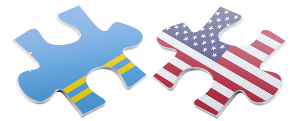Two puzzle pieces, one adorned with the Aruba flag and the other with the American flag, poised to...
