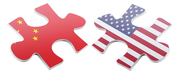 Two jigsaw puzzle pieces, one featuring the flag of China and the other displaying the flag of the United States, symbolize international relations and global interdependence.