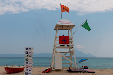 Lifeguard tower on the beach. Lifeguard on beach to ensure safety on the beach. Cloudscape over the...