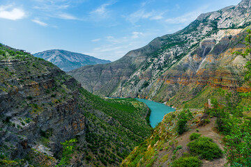 Panoramic landscape of a deep picturesque canyon of the Caucasian mountains of Dagestan and the azure mountain river Sulak. Russia