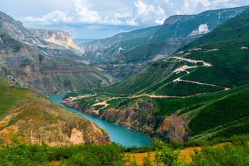 Picturesque landscape of Sulak Canyon with serpentine road and winding mountain river in the mountains of North Caucasus Dagestan. Russia