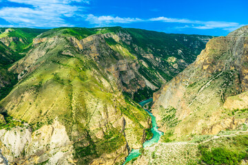 Panoramic landscape of a deep picturesque canyon of the Caucasian mountains of Dagestan and the azure mountain river Sulak. Russia