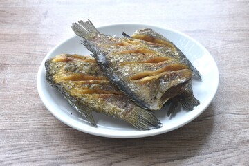 deep fried snake skin catfish or gourami arranging on dish  