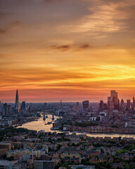 Elevated view of the skyline of London, England, during summer sunset time with the beautiful sky as copy space
