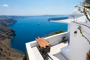 White architecture in Santorini island, Greece. Beautiful terrace with sea view at sunny day.