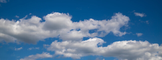 Beautiful blue sky with white Altocumulus undulatus clouds.