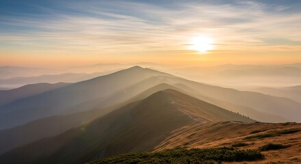 Majestic mountain range illuminated by golden sunrise creating a sense of tranquility and peace