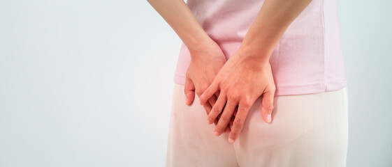 hand holding bottom because having abdominal pain and hemorrhoids, health care, constipation, Anatomical, suffering from pain, abdominal, bowel problem, bloody diarrhea, stomach ache, cancer