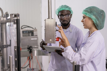 quality supervisor or food or beverages technician change parameter and condition control food or...