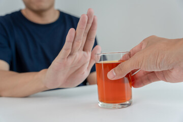 man refuses say no and avoid to drink an alcohol whiskey, stopping hand sign male, alcoholism...