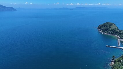 Aerial view of the calm blue waters and coastline of the Seto Inland Sea, Japan

