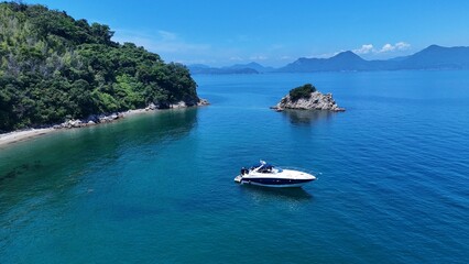 Aerial view of a boat floating in the calm blue waters of the Seto Inland Sea, Japan
