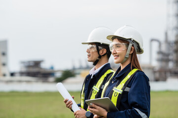 Engineering Team Looking Towards the Future with a Shared Vision. Two people wearing safety gear...