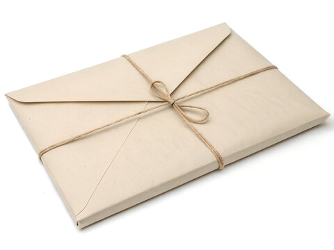 Wrapped envelope packaging tied with string on a white background with copy space