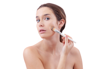 Young woman with natural skin applying foundation with a makeup brush, visible streak on cheek. Skincare and beauty routine concept. Isolated on white background, clean and minimal look