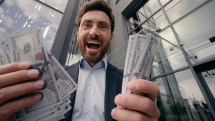 Close up happy excited middle-aged Caucasian business man counting money cash dollars banknotes...
