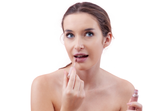 Young woman applying lipstick on her lips with a lip brush applicator as part of her makeup routine. Beauty concept with a fresh, natural look. Isolated on white background, clean and minimal