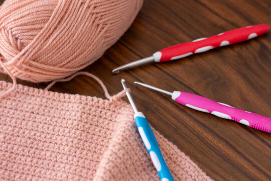 Hooks and threads for crocheting. Hobbies, creativity and handicrafts. Home leisure. Photo view from above