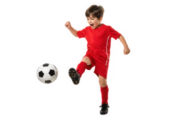  Excited young boy in red sports uniform dynamically kicking a soccer ball with energy and focus. © Almas Ikhwan