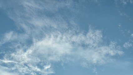 Beautiful Cirrus and Stratocumulus Clouds Against Blue Sky.