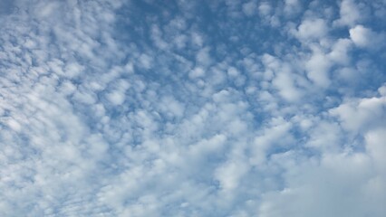 Light and Airy Cloudscape with Blue Sky Background.