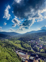 Fototapeta premium Scenic View of the Carpathian Mountains Covered by Clouds on a Sunny Day