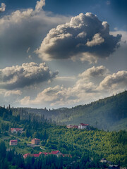 Scenic View of the Carpathian Mountains Covered by Clouds on a Sunny Day
