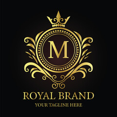 Golden shield vector emblem with crown and ribbon, a vintage award design element LOGO M