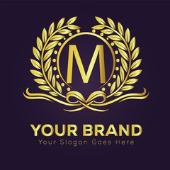 Golden laurel wreath award emblem with shield, M vintage vector illustration of a royal crest design