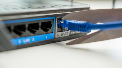 Scissors cut the router cables. 