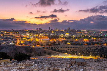 The view of the Old City of Jerusalem at sunset and the slopes of the Mount of Olives in Jerusalem, Israel
