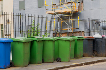 Wheelie bins in row for refuge collection outdoors